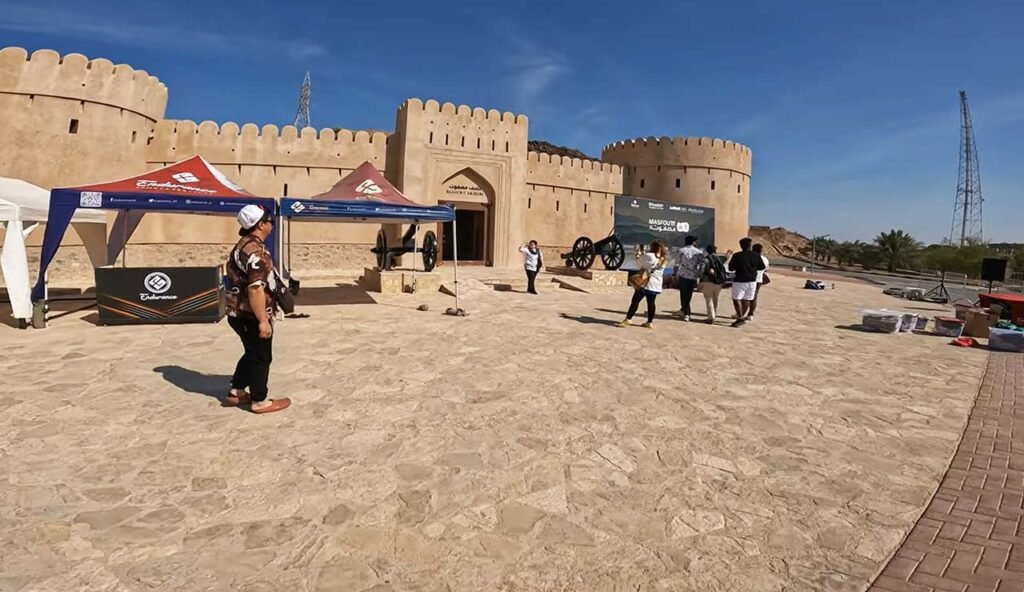 Hatta Museum inside Hatta Heritage Village with stone fort and Hajar Mountains behind